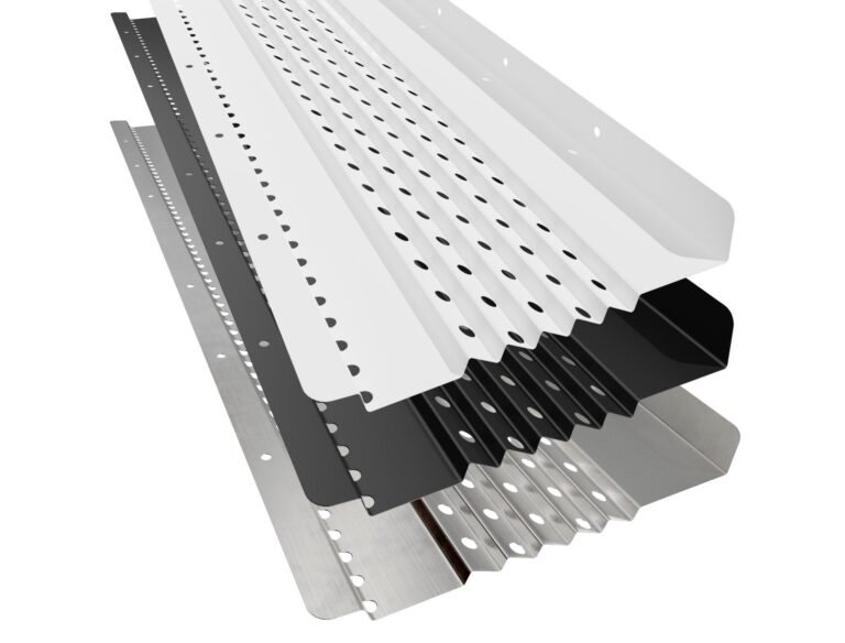 Several metal gutter guards in various finishes (white, black, and silver) are stacked diagonally, showcasing their perforated surfaces and angled edges.